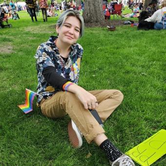 Lauren O'Sullivan sitting in the grass