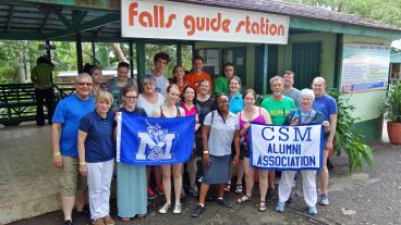 The Mines Band takes a group photo outside Dunn's River Falls & Park. (Photo Credit: CSMAA Board President Ray Priestley ’79)