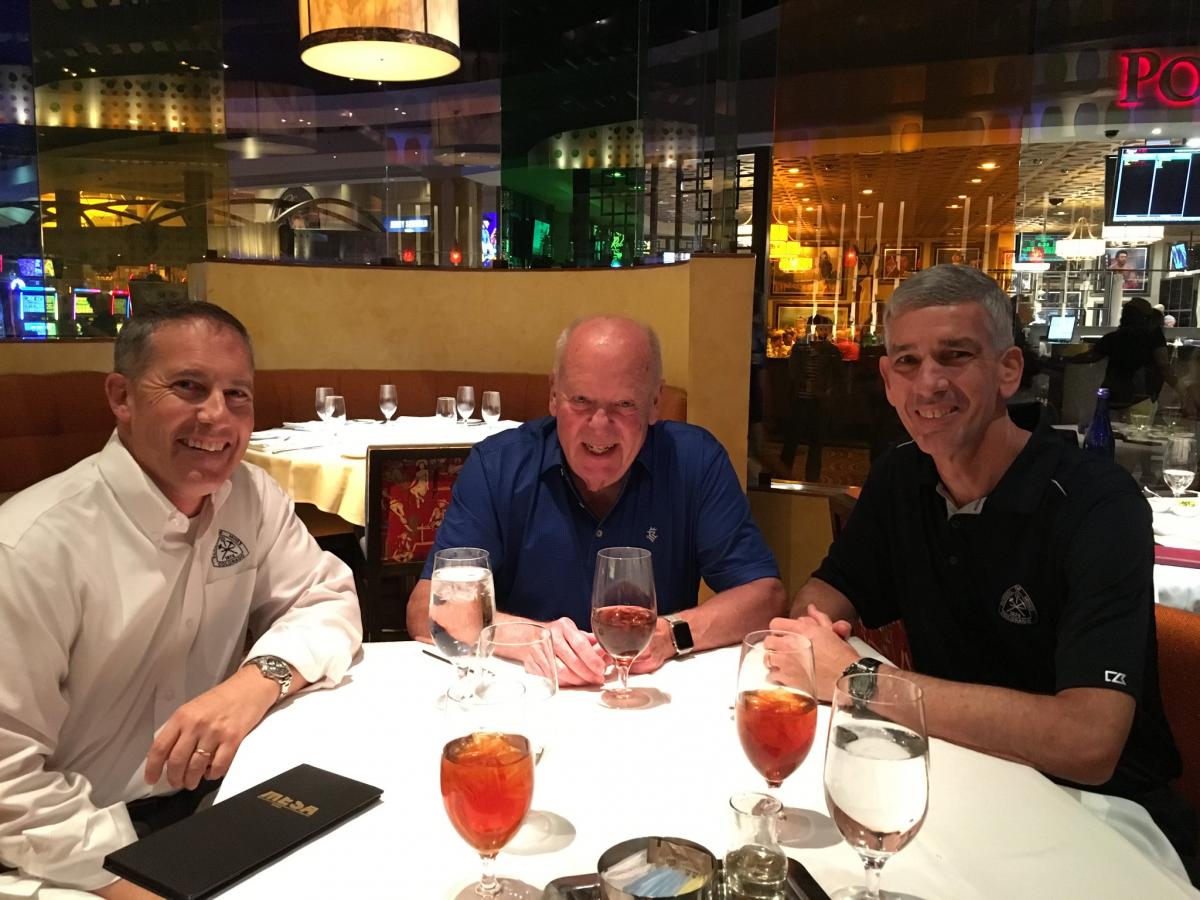 CSM Foundation President Brian Winkelbauer, Stanley Dempsey and Mines President Paul C. Johnson enjoy dinner together before the induction ceremony. 