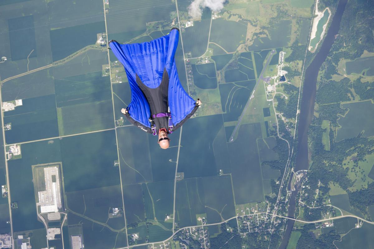 Derek Parks skydives in a wingsuit over Chicago.