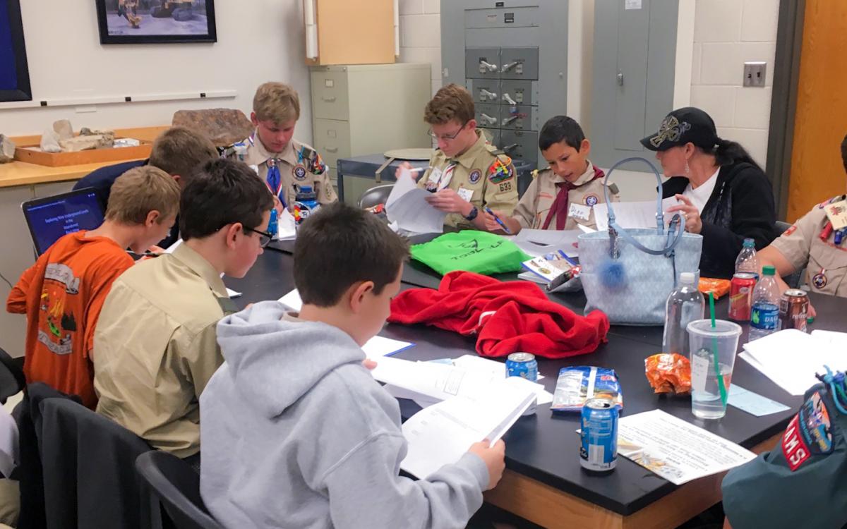 Boy Scouts working to earn their Mining in Society merit badges with SME at Mines.
