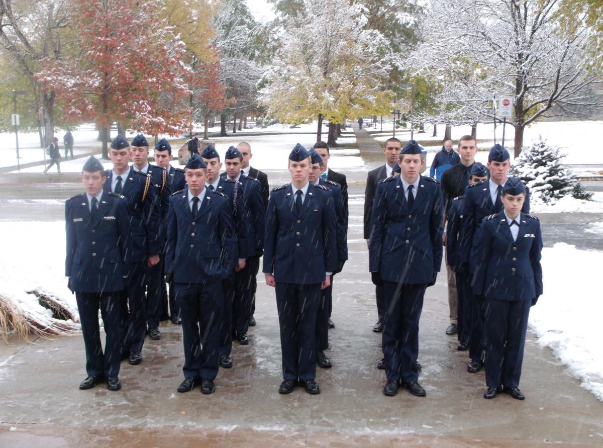 A group of Air Force ROTC cadets stand in formation during the Veteran's Day ceremony in November 2015