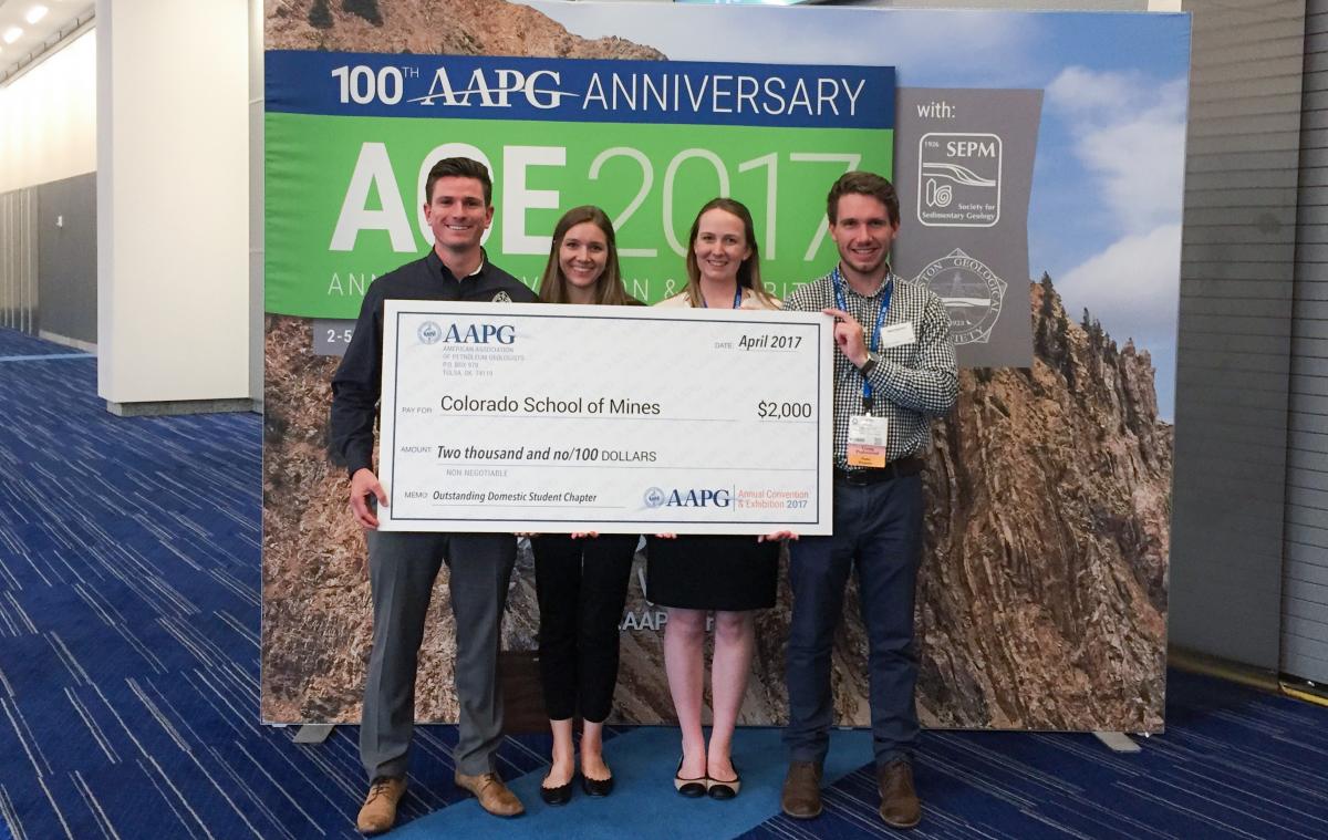  Mines AAPG Student Chapter members hold their award check. Left to right: Joshua Payne, Chapter President; Elizabeth Wilson, Treasurer; Julia Peacodk, Vice President; Mark Hansford.