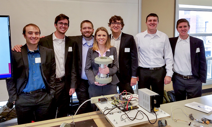 Seven students from the winning senior design team, Pig Patrol. Mechanical Engineering