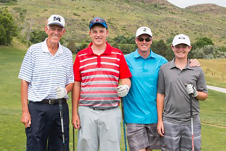 Joe Coors Jr. with son Doug and grandsons at golf outing.