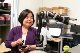 Xiaoli Zhang works in her robotics lab at Mines
