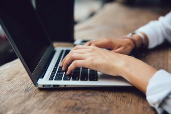 Stock image of woman typing on laptop