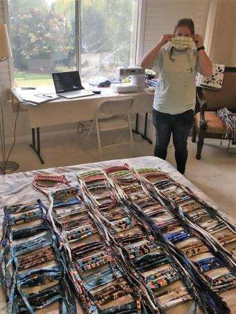 Hannah Deahl with the cloth masks she has sewn