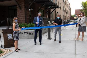 Mines President Paul C. Johnson and Confluence CEO Tim Walsh cut the ribbon in front of 1750 Jackson