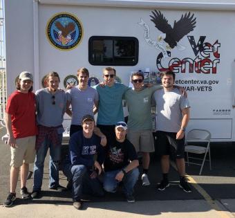 Kappa Sigma members in front of Vet Center 