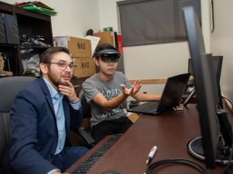 Tom Williams works with a student in Mirror Lab