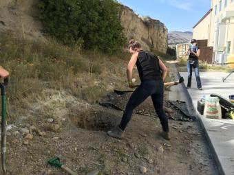 Student digs a hole for seismometer