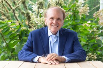 Daniel Yergin seated at a table