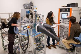 Students and faculty working on Environmental X-ray Photoelectron Spectrometer