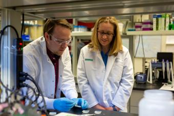 Melissa Krebs, right, looks on as student works with hydrogel bandage material