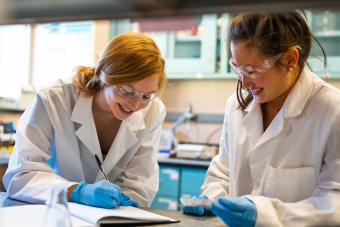 Two female students work in a lab