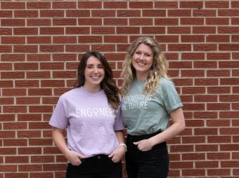 Amanda Field and Claire Knight standing in front of brick wall