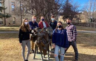 SME Design Competition team around Blaster statue