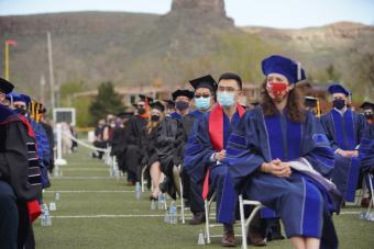 Graduates on Marv Kay Field during Spring 2021 Graduate Commencement