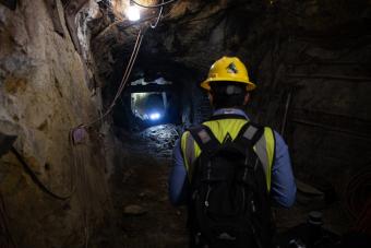 Graduate student operates a robot in Edgar Mine