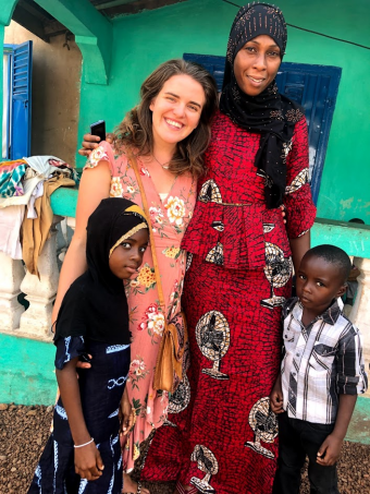 Dot Walch in Guinea with host family