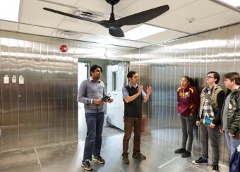 Paulo Tabares in the lab with students