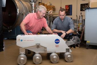 George Sowers with a lunar rover prototype