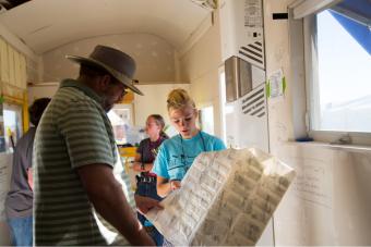 Mines student explains a building material in Mines Tiny House