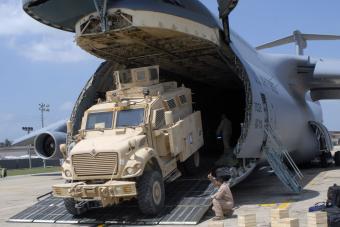 MRAP rolling off a plane