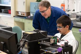 Jeff King works with a student 