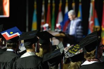 Mines students with decorated caps at commencement