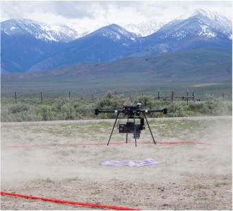 Photo of a drone landing near mountains