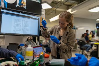 Student runs test on sample in the lab