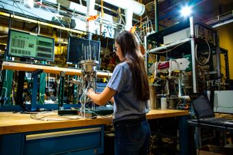 Female student works in fuel cell center