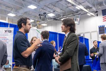 Geoffrey Pott, a fourth-year mechanical engineering student, meets with a recruiter from Consolidated Nuclear Security during day one of Fall 2023 Career Days.