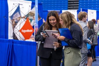 Students review their schedules for Fall 2023 Career Days.