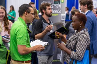 Geophysical engineering PhD student Dorothy Kanini Mwanzia meets with Adam Tuppen '19 from BP Energy.