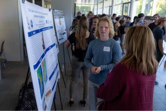 Student shares his research on landslides with a judge