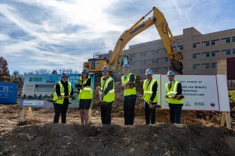 USGS, DOI and Mines officials throw a ceremonial scoop of dirt at the EMRF Groundbreaking