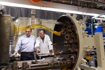 Rob Braun and Neal Sullivan inspect the solid oxide fuel cell system