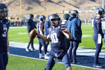 John Matocha warming up along the sidelines