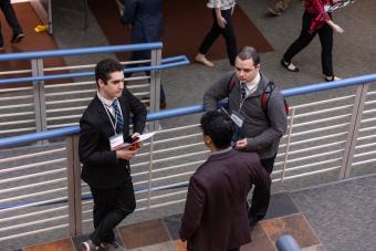Three students talk during Career Days