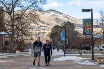 students walking on pedestrian plaza in january