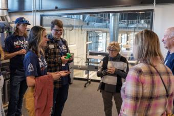 Students talk about makerspace to alumni