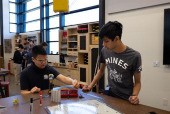 Fynn Promboon and Dev Patel work in the Cornerstone Design Workshop
