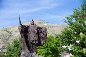 Statue on Mines campus with M behind