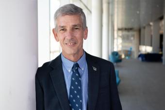 Paul Johnson standing in atrium of CoorsTek Center