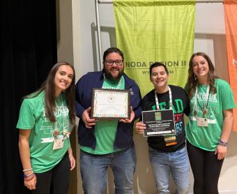 Mines staff from NEST office pose with award plaque