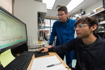 Mike McGuirk in the lab with student