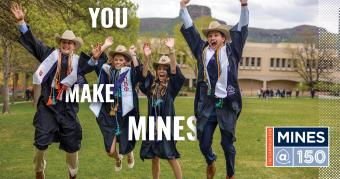 Graduates in gowns jumping in the air on grassy lawn